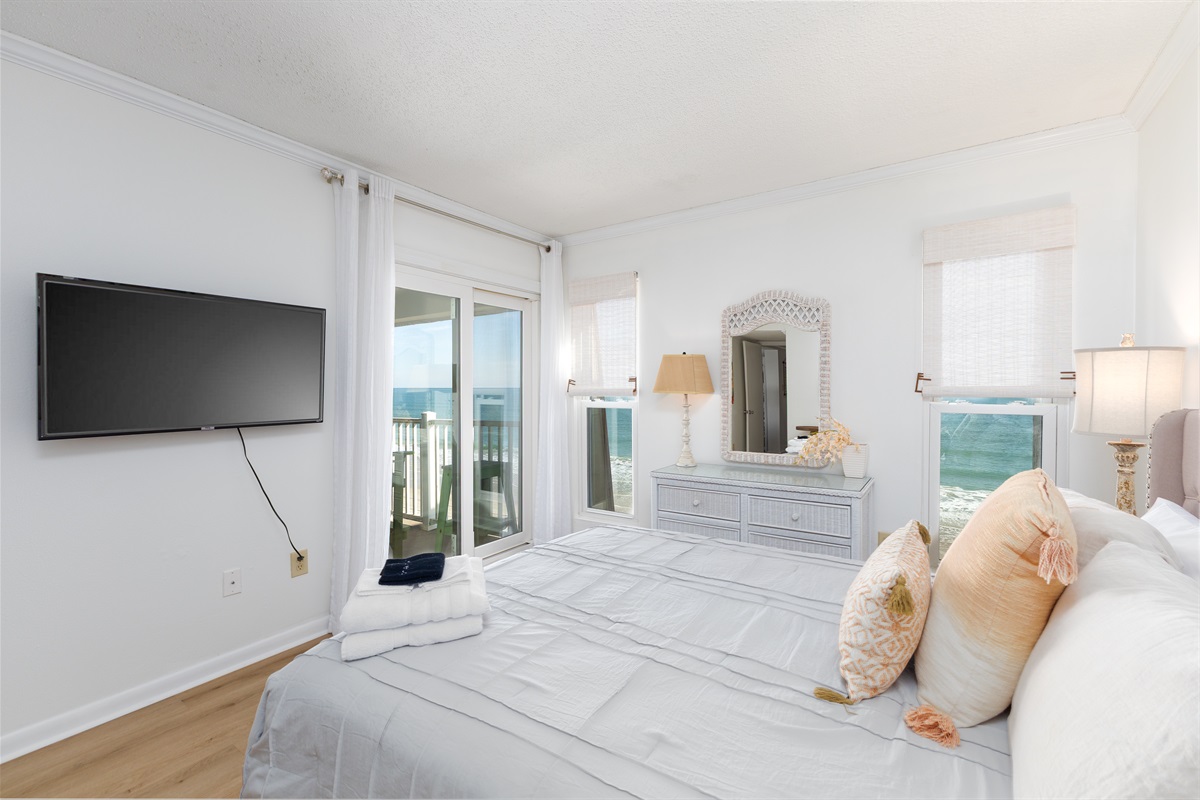 Oceanfront master bedroom with private balcony access