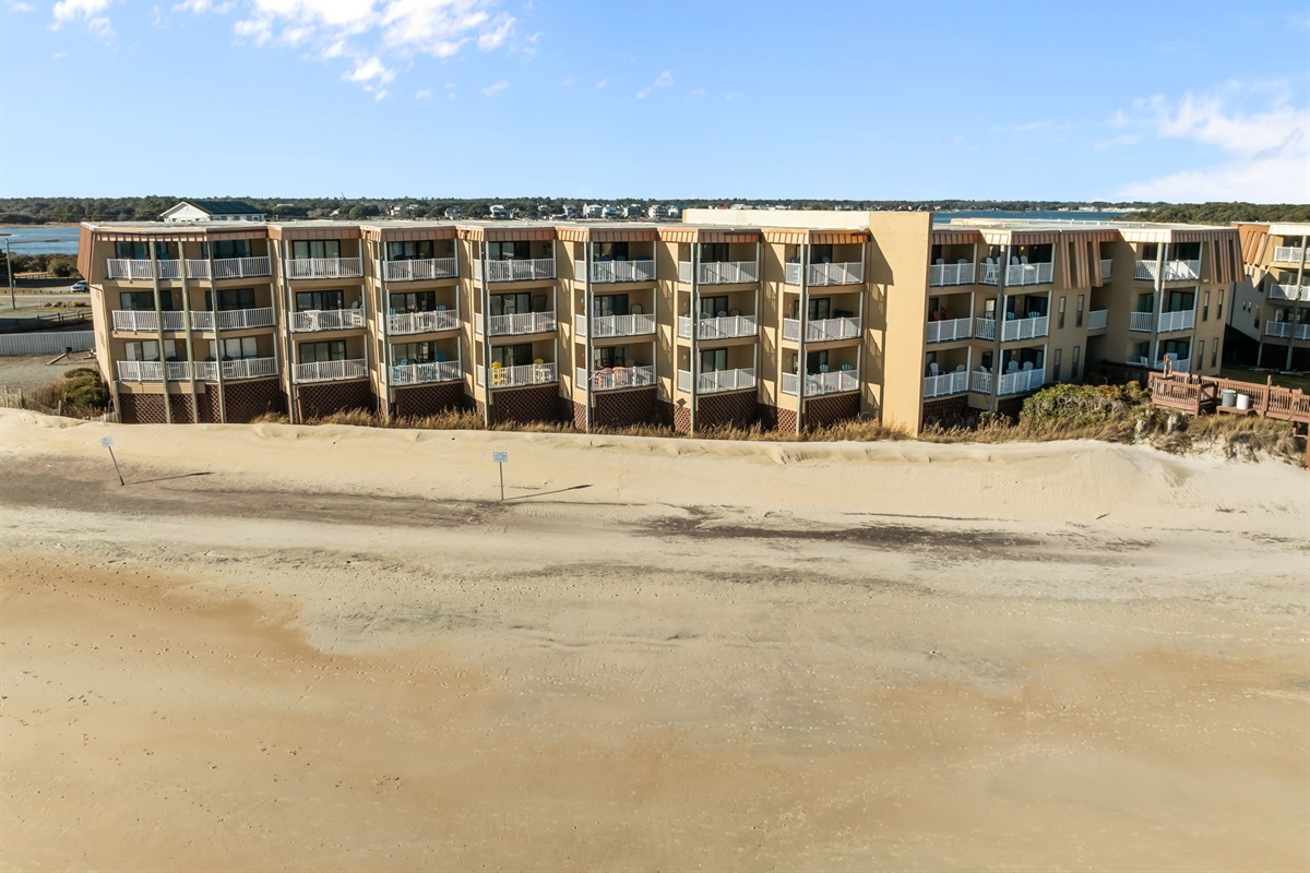 Topsail Dunes sits right behind the dunes, offering oceanfront balconies and direct access to the beach below