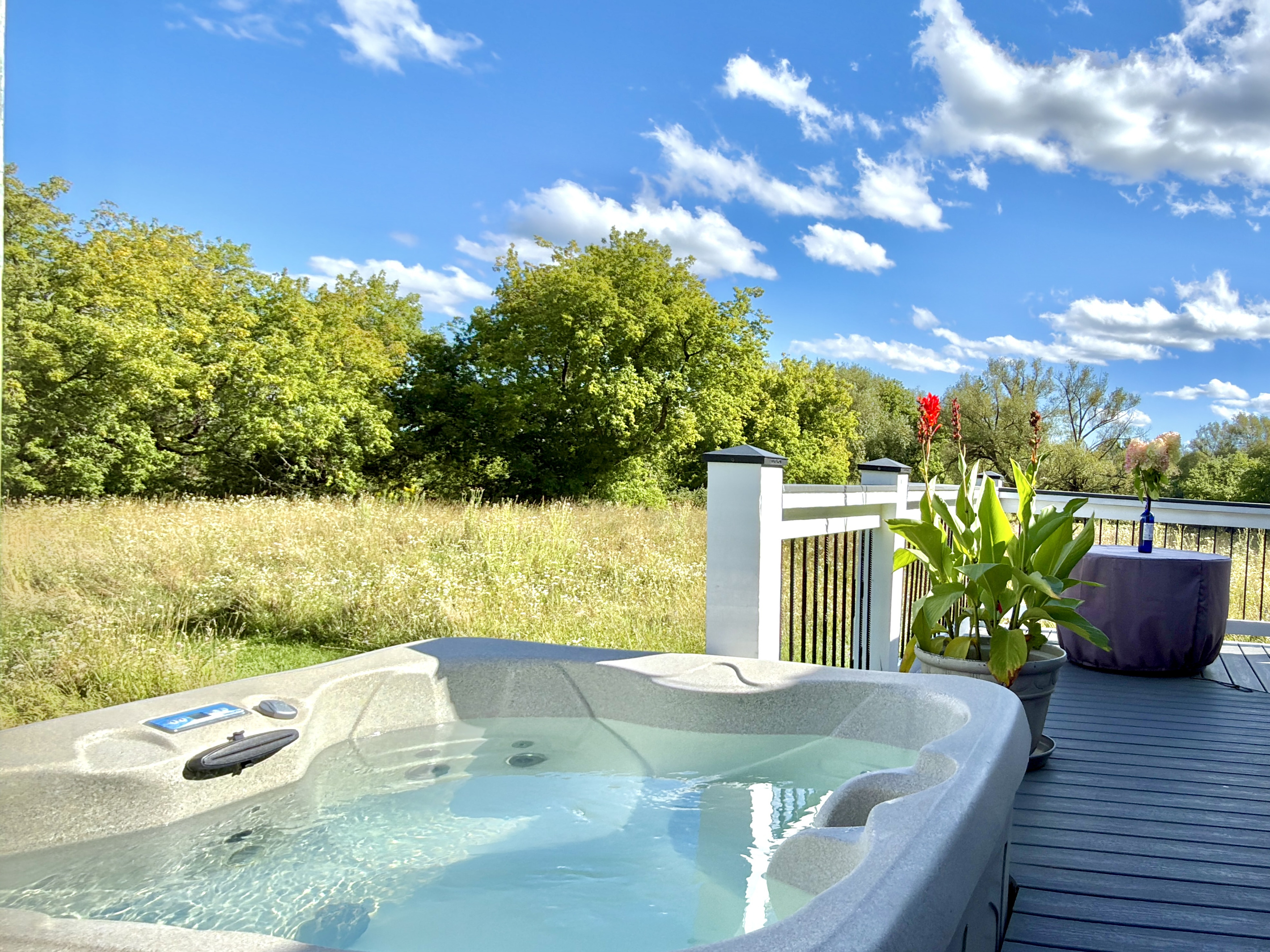 Soak under the beautiful open sky. Our outdoor hot tub features an open-air design so you can stargaze by night or feel the rain and winter snow as you relax. Nestled against a quiet meadow, tune into the gentle sounds of frogs and birdsong.