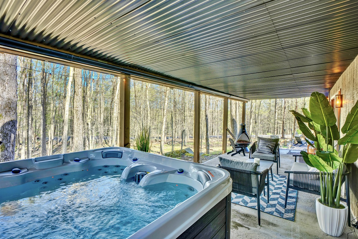 “Soak in the hot tub surrounded by trees — pure relaxation after a day outdoors.”