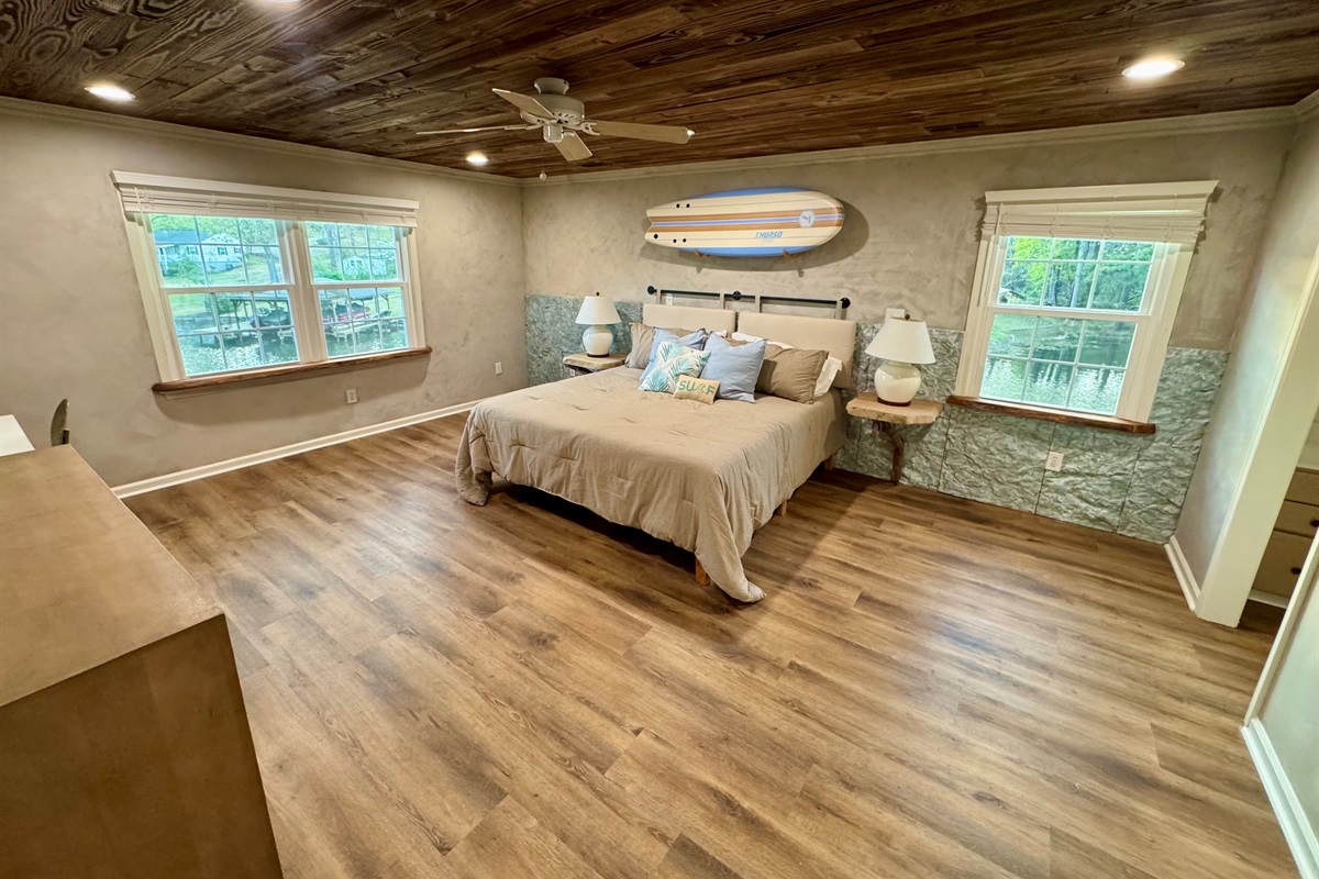 Extra large master bedroom with sitting area and desk. 
