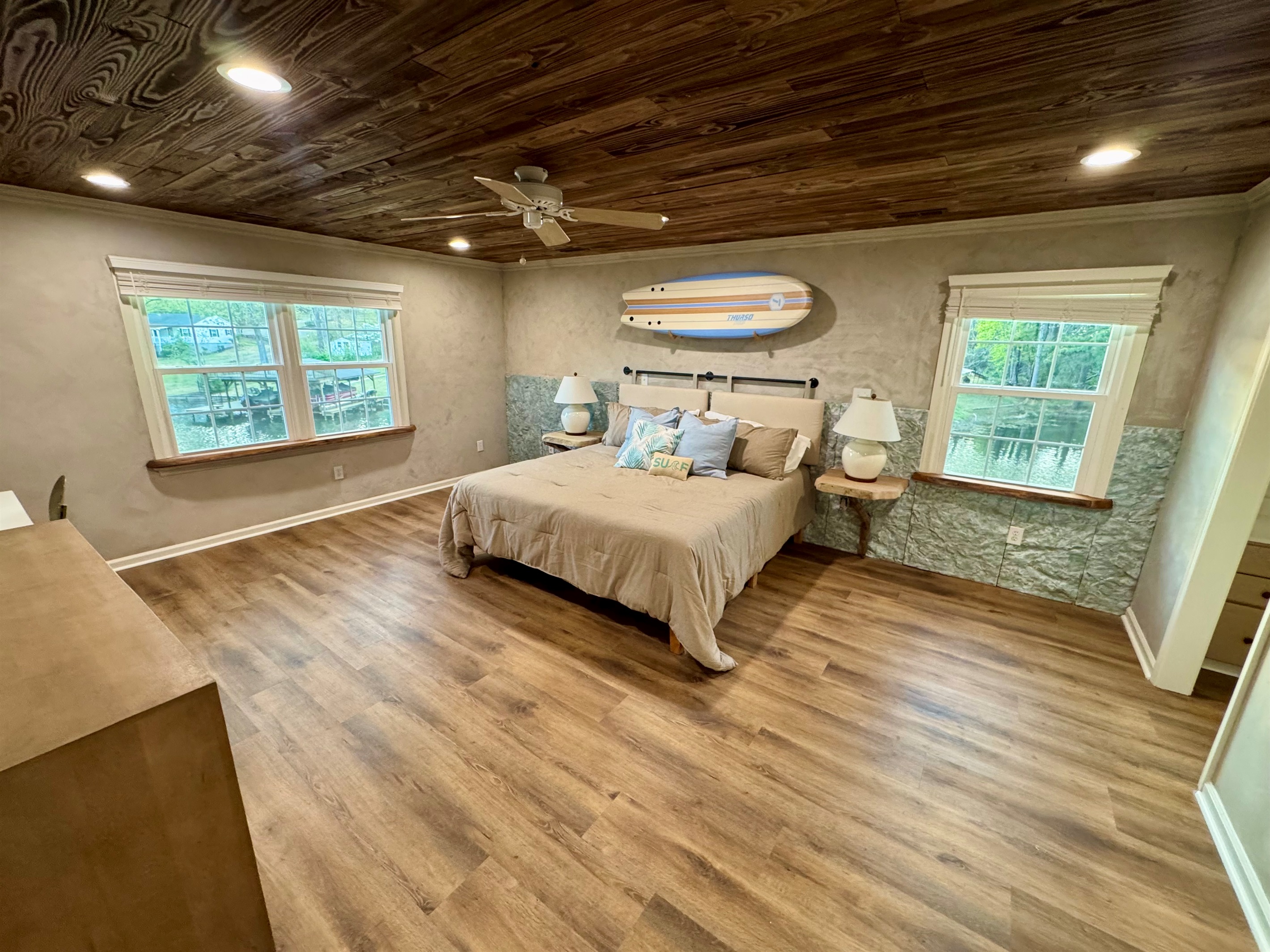 Extra large master bedroom with sitting area and desk. 