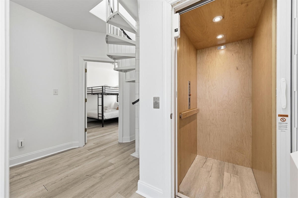 Easy access between floors with a private in-home elevator and spiral staircase nearby