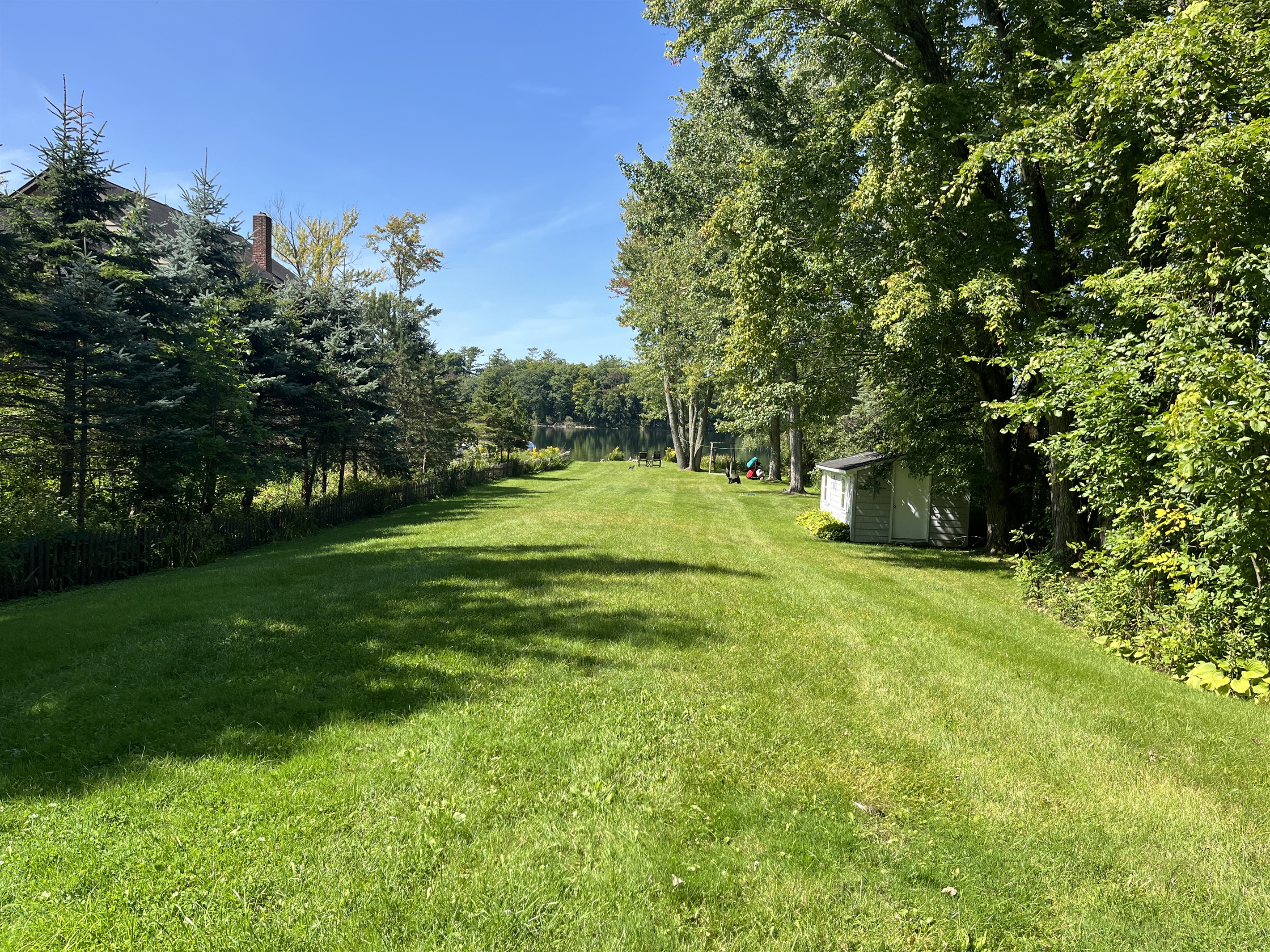 Large lawn leading to the waterfront