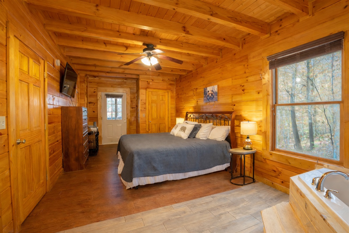 With private access to the back deck and space for your fur baby, you'll find this master bedroom private and spacious!