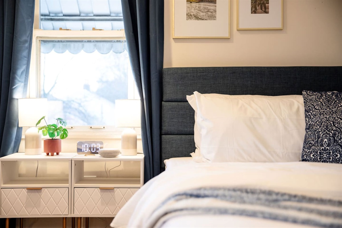 Spacious bedroom featuring two king beds, offering ample comfort and plenty of space for families or groups looking to relax together.