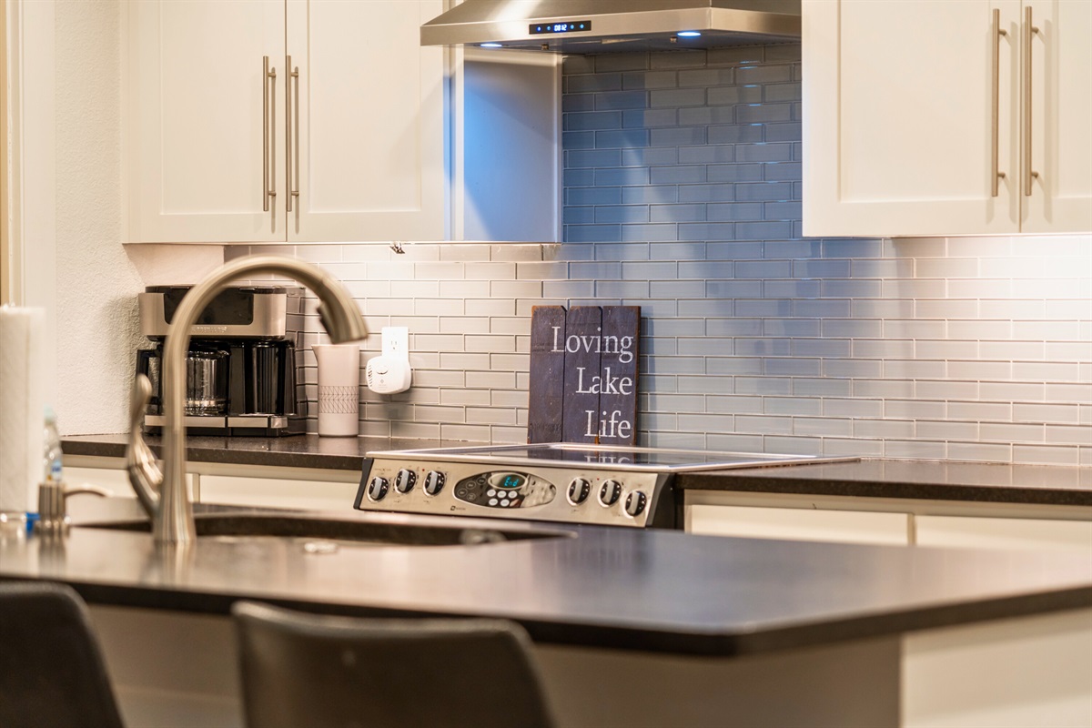 The Kitchen Island Provides Extra Prep Space and Seating for 4