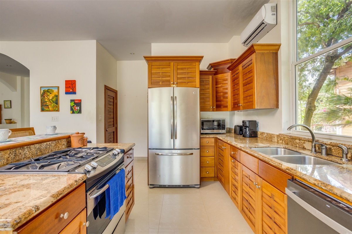 Double door refrigerator with drawer freezer. Microwave, toster and coffee maker