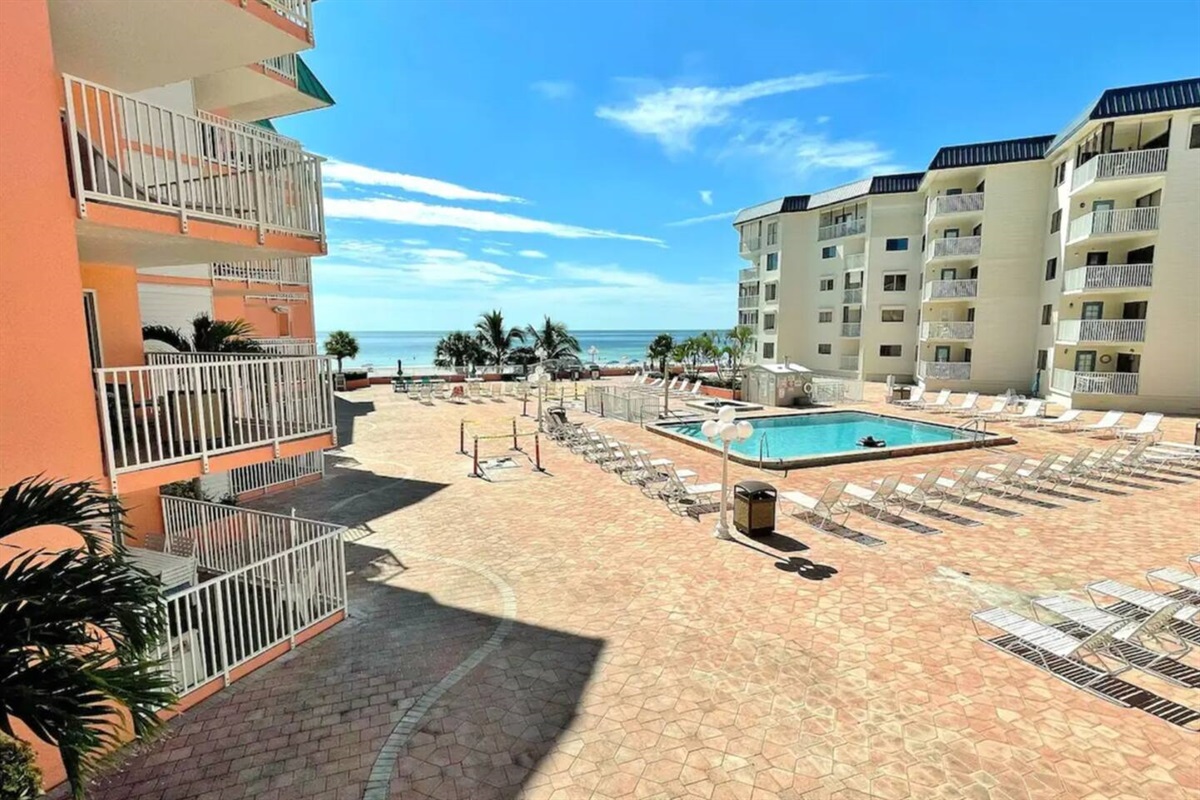 Heated Pool open year round with ample seating, overlooking Gulf of Mexico.