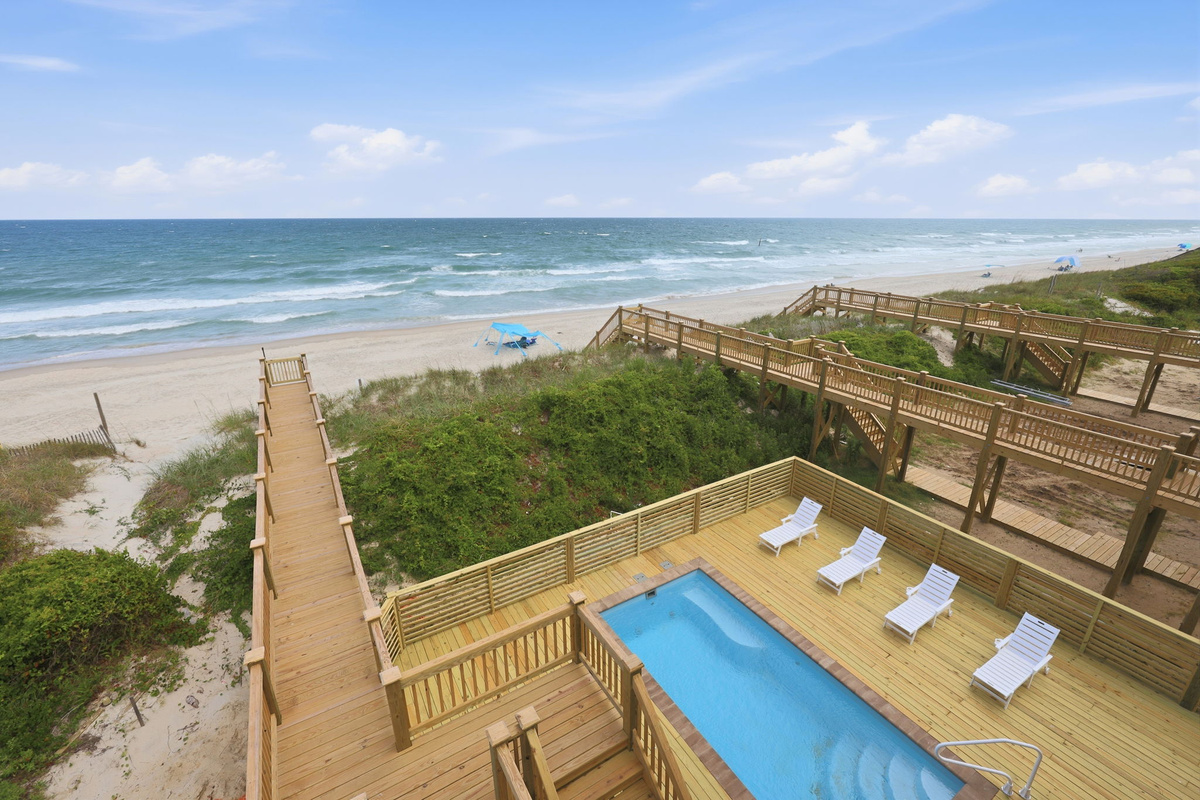 Private beach access walkway leading directly to the shoreline