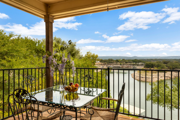 Upper balcony dining set with a view straight down the cove