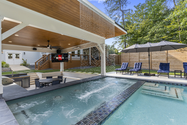 Hot tub spa with swim up bar and waterfall feature!