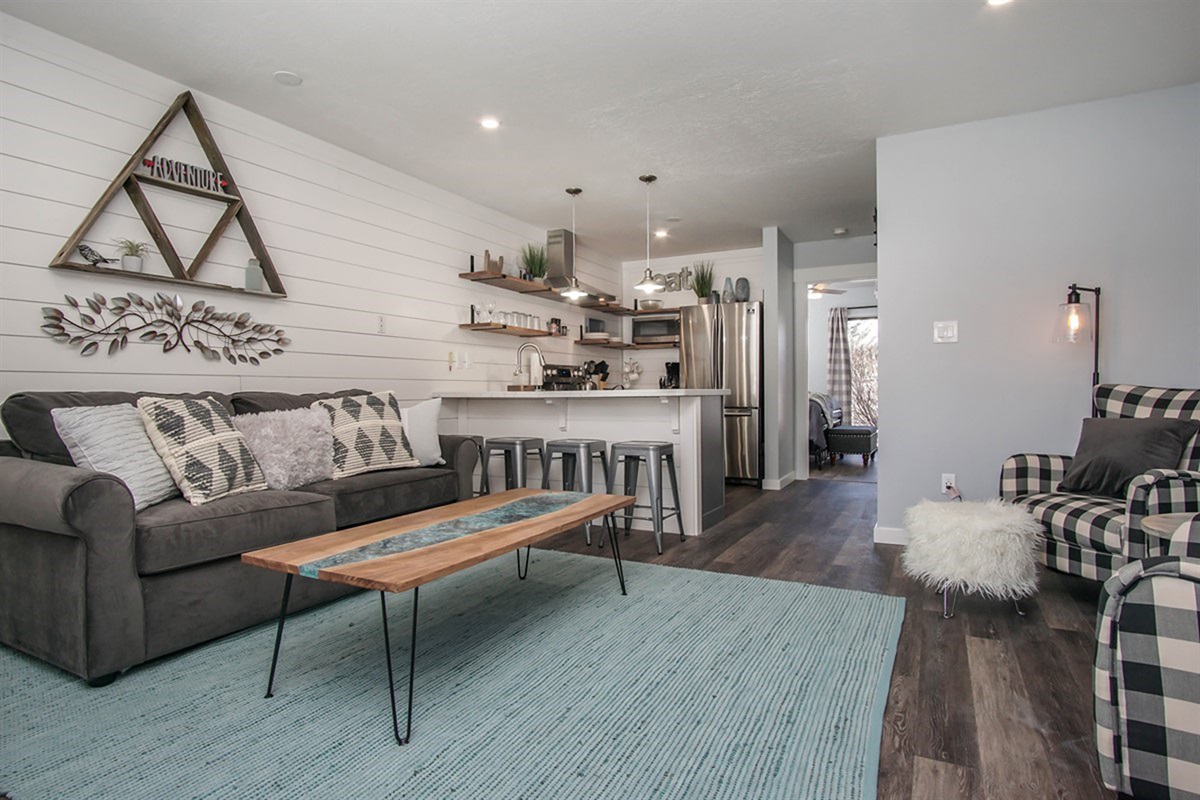 Bright, open-concept space with comfortable seating and easy flow into the kitchen and dining area.