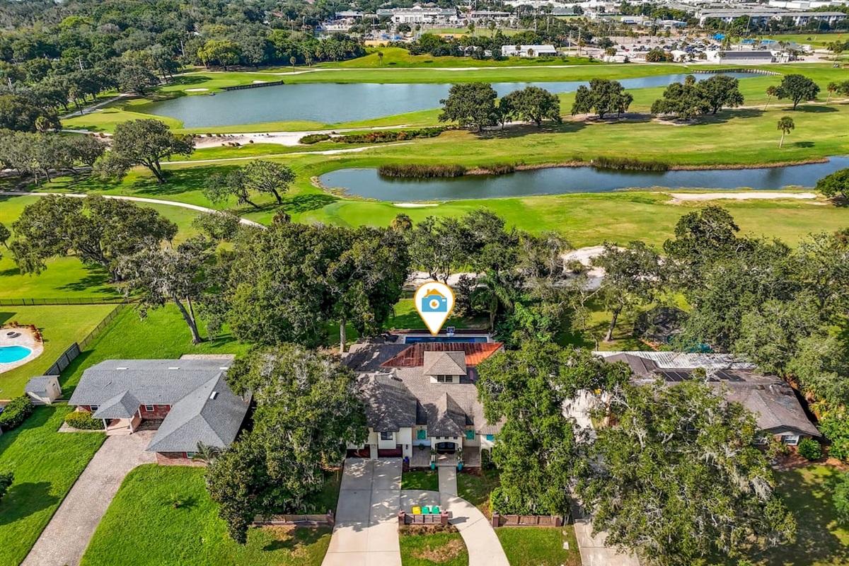 Arial view of the home next to the golf courseArial view of the home next to the golf course