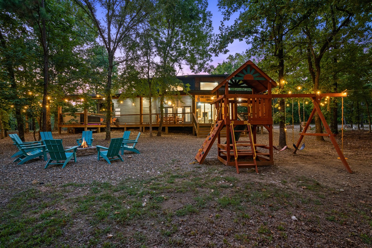 Fire pit seating area and private playset—fun for all ages.