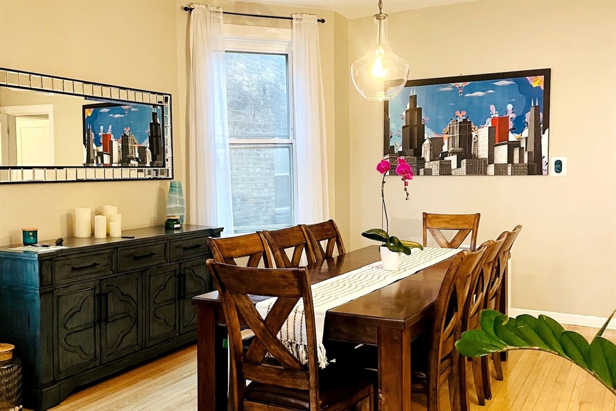 Dining room with large table perfect for family meals and gatherings.