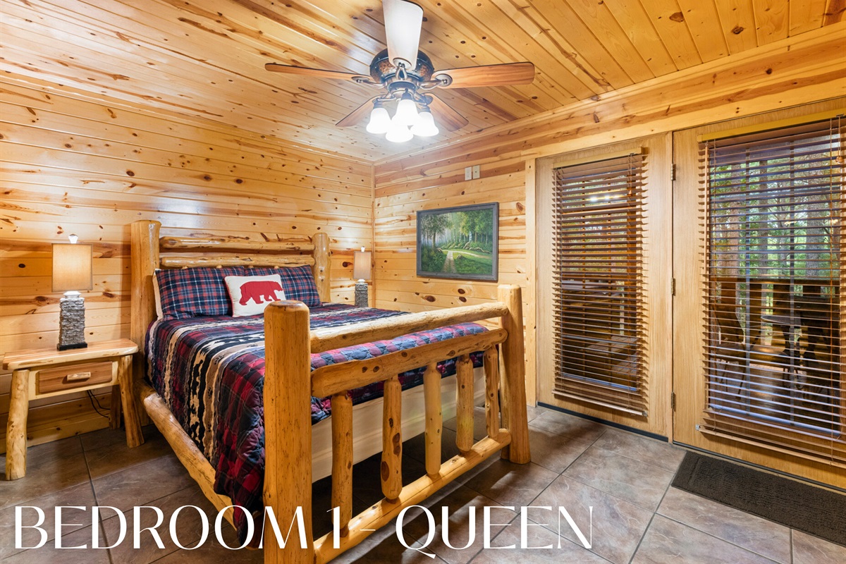 Bedroom 1 with queen bed and cozy cabin vibes