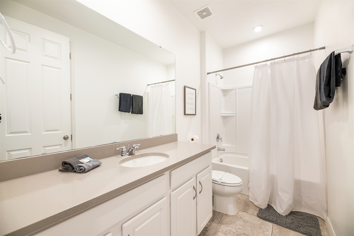 The bathroom for bedroom 6 is spacious and clean.