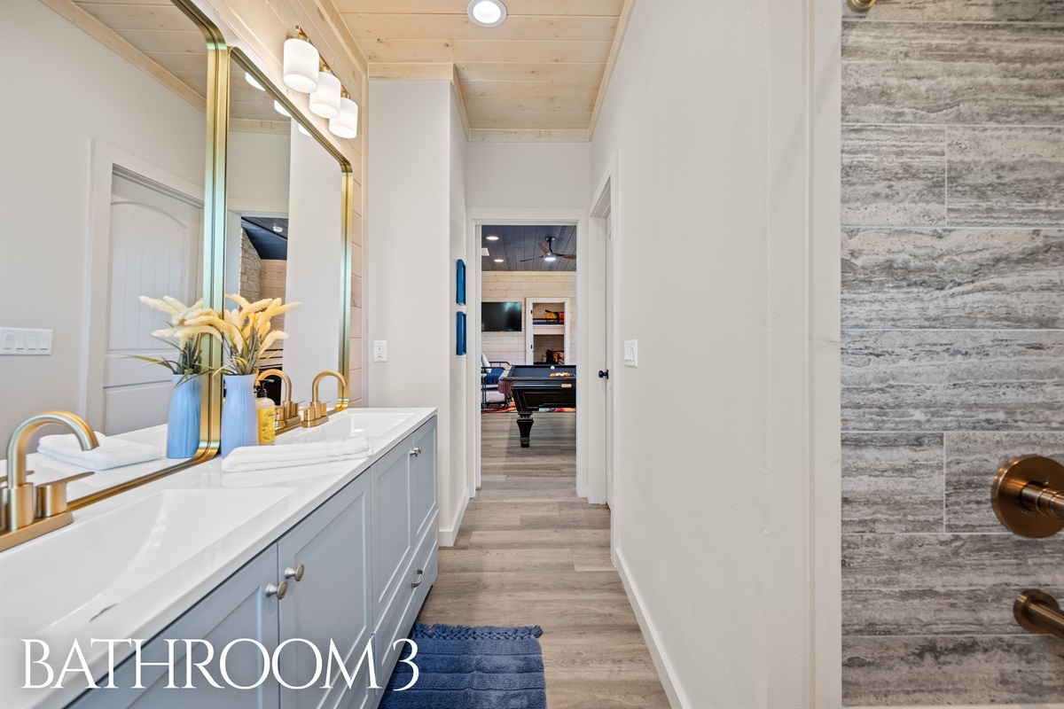 Bathroom 3 with dual vanity and modern farmhouse details.
