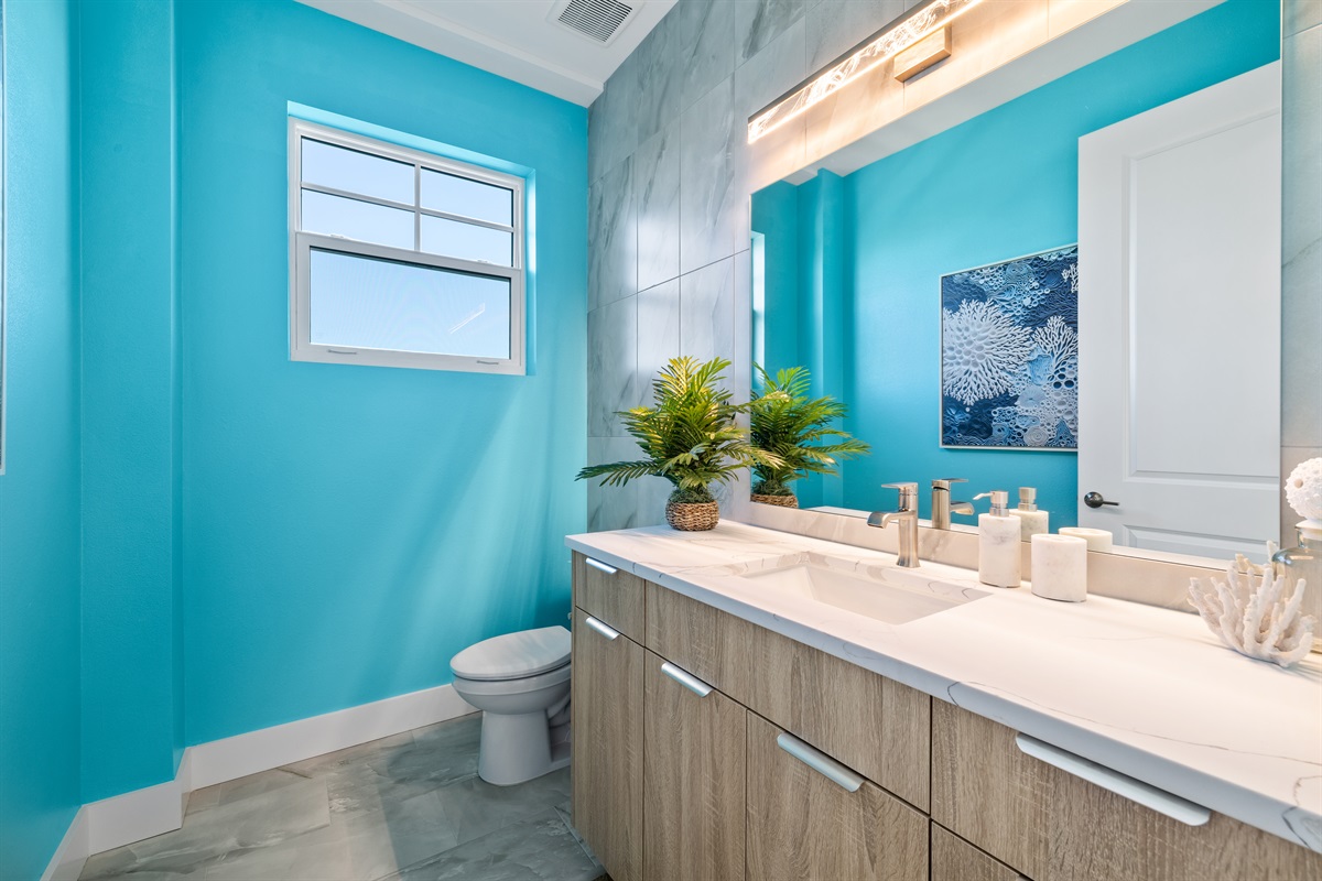 Half-bath connected to the living room and kitchen