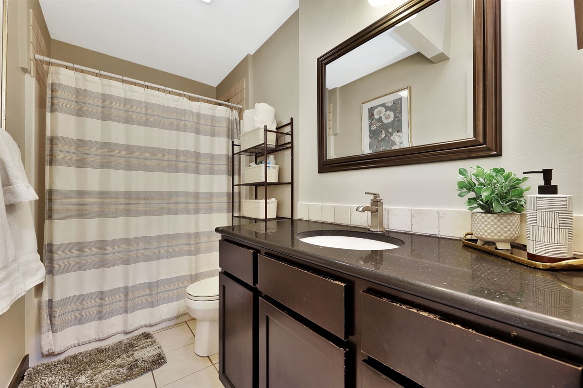 Well appointed Bathroom with crisp white linens.