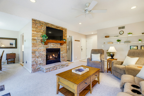 The floor-to-ceiling stone fireplace brings classic mountain character to the heart of The Haven.