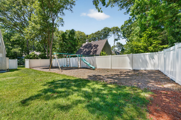Expansive backyard offering plenty of open space for family fun, games, and relaxation.