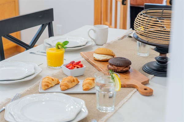 Enjoy meals together at the spacious dining table, perfect for family dinners and game nights.