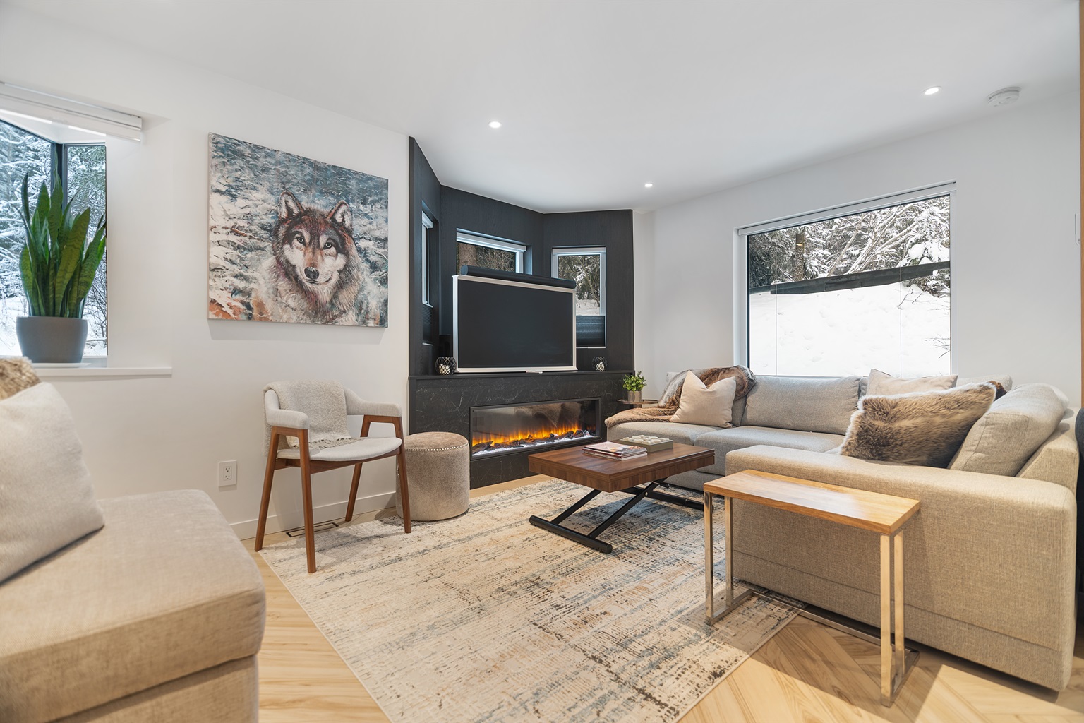 Best Whistler Rental location living room w/ fireplace, heated floors, Smart TV, Sonos Surround. Skier's Plaza Village centre ski-in/out is 200 meters from the couch. 
