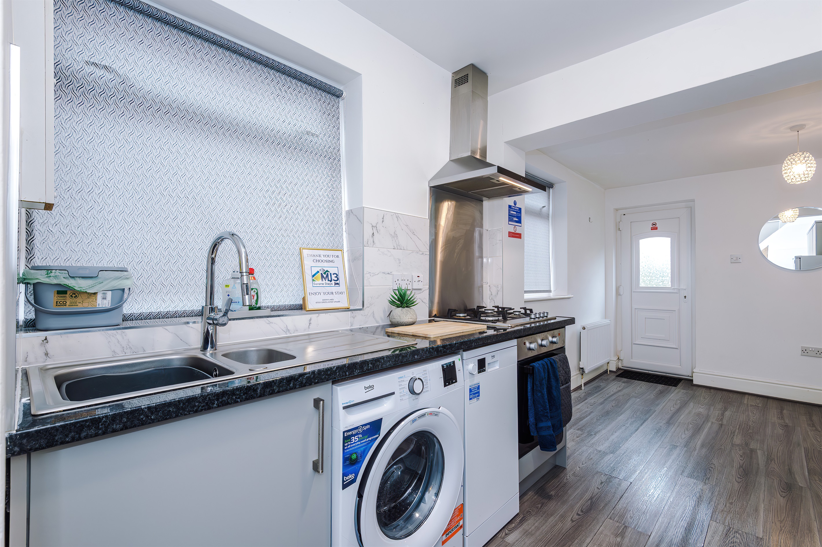 The modern, clean kitchen benefits from utensils, crockery, microwave, oven, hob, fridge freezer, washer & dishwasher 