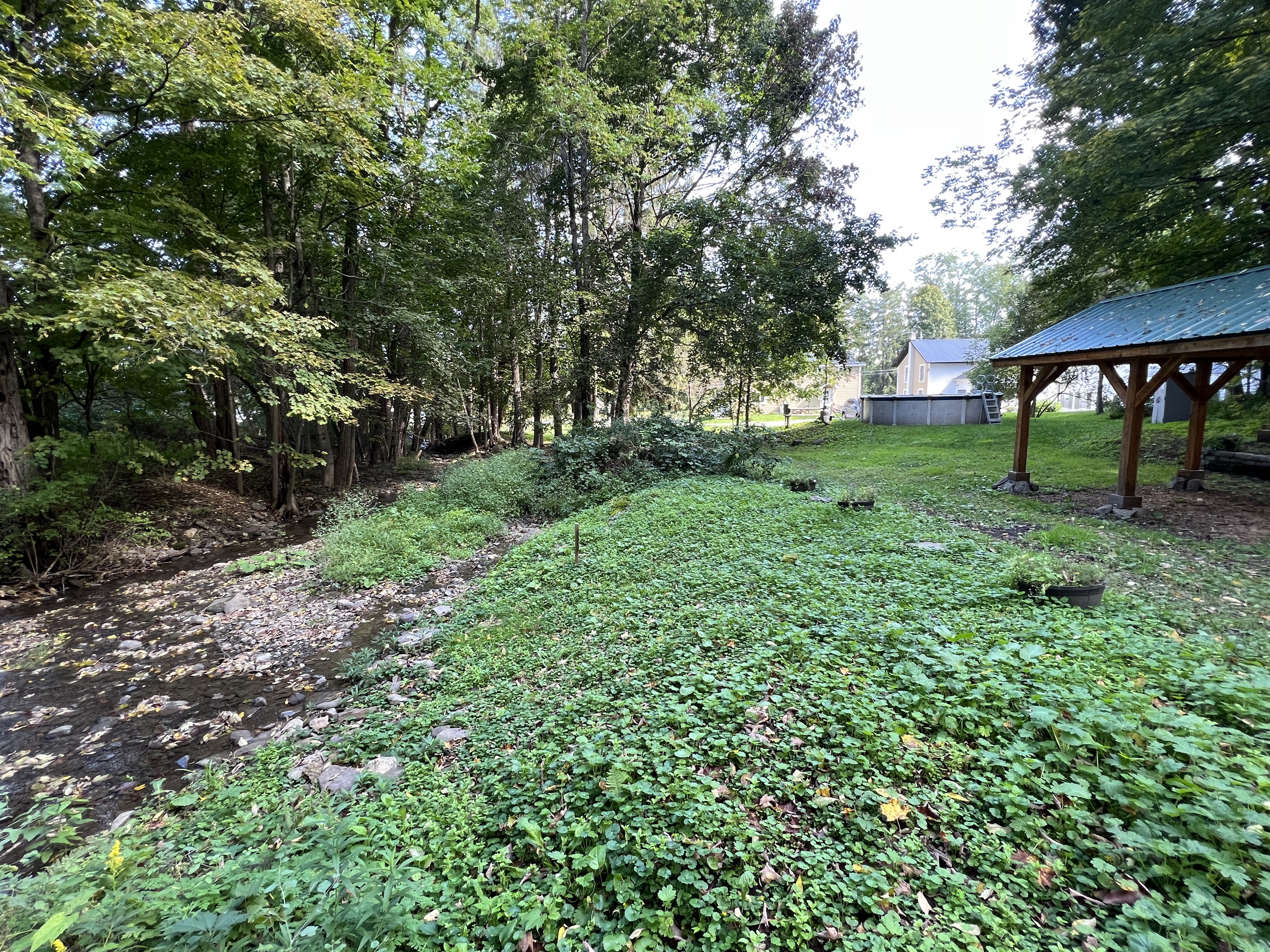 A sweet little babbling Brooke runs along side the shared backyard.
