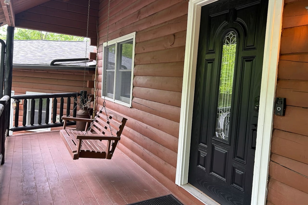 Swing on cabin front porch. Great place to listen to birds and watch deer.