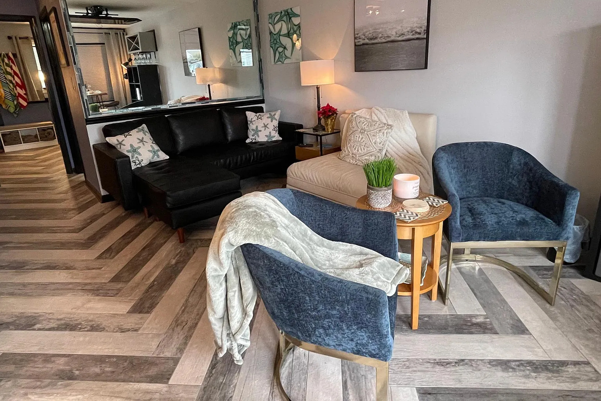 Living room area with large TV that will drop from the ceiling.