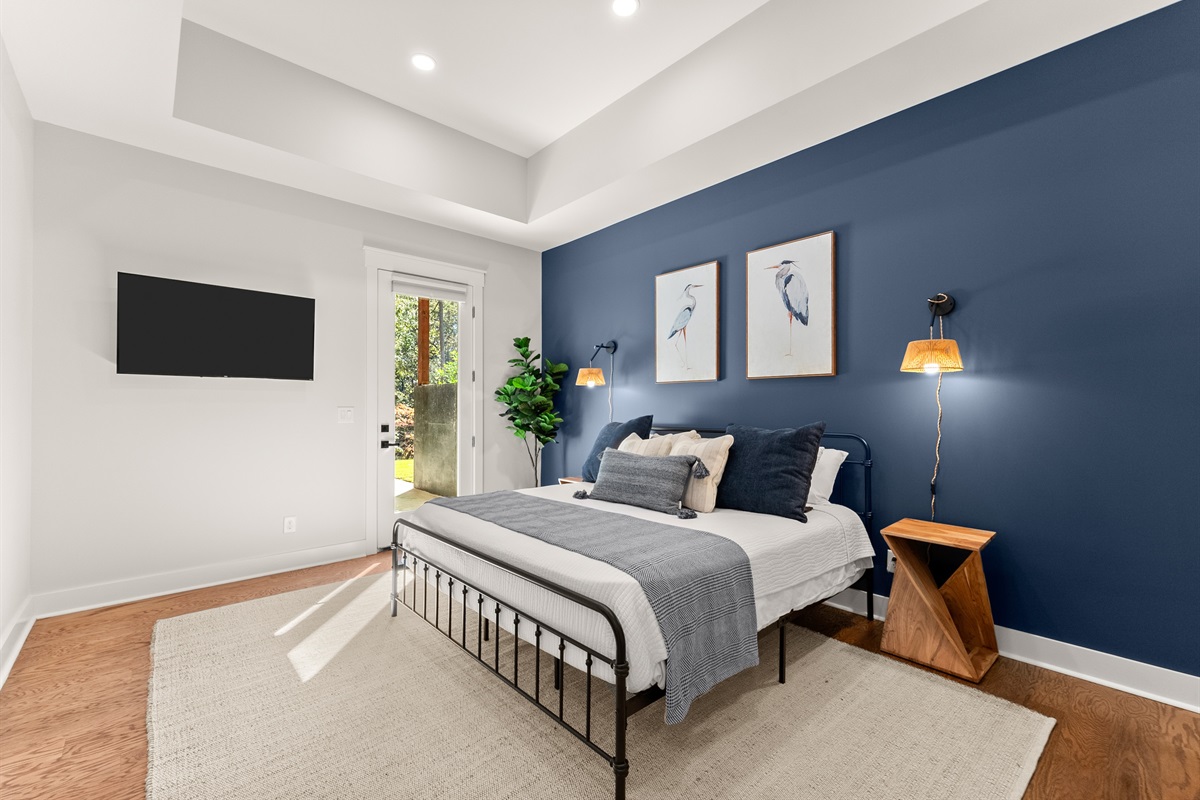 Lower level King Suite — elegant design and Smart TV for quiet evenings.