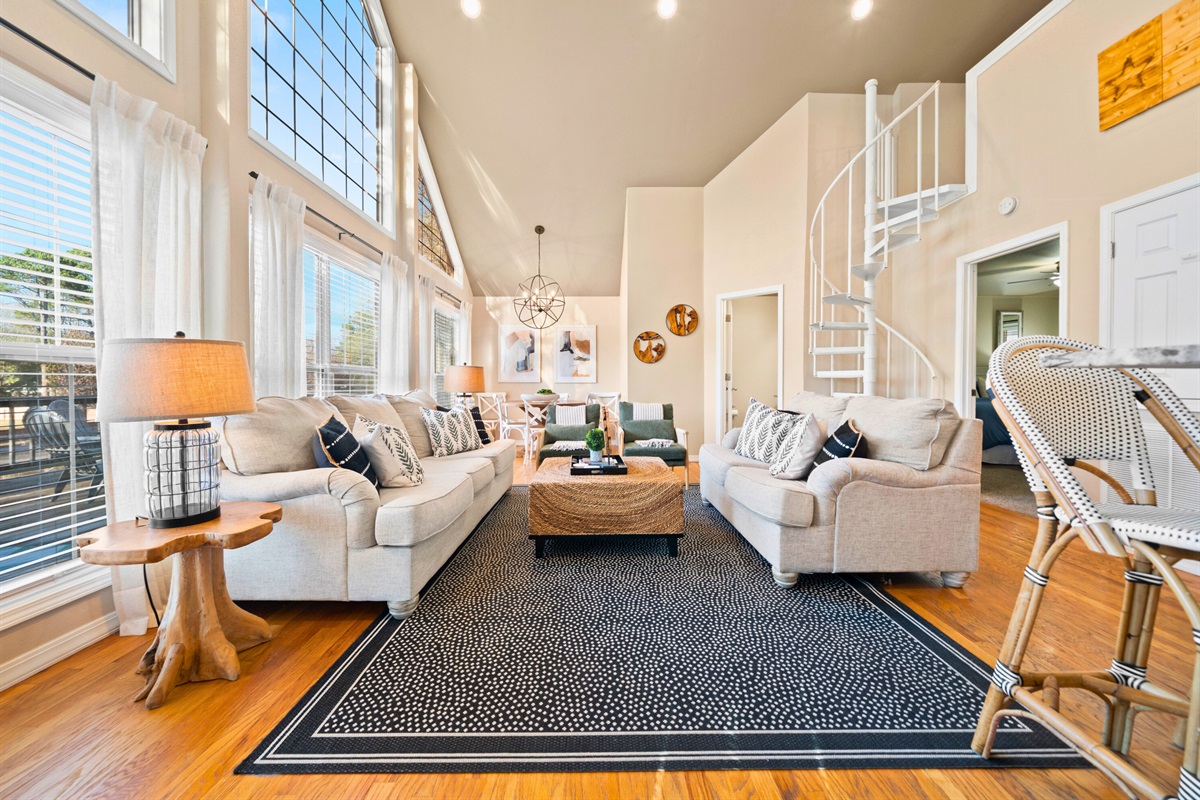 Comfortable seating and wide-open views make this living room the perfect place to relax together throughout the day.