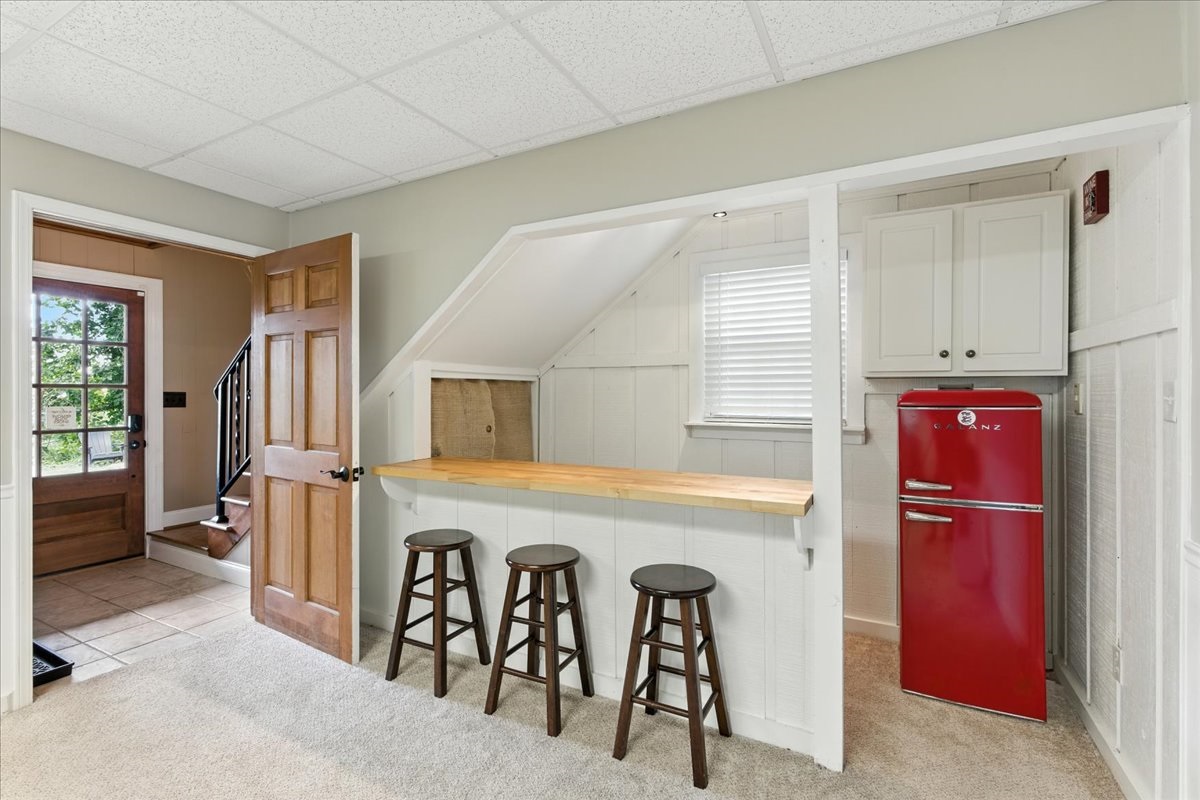 Countertop bar with high stools, perfect for casual drinking or evening events