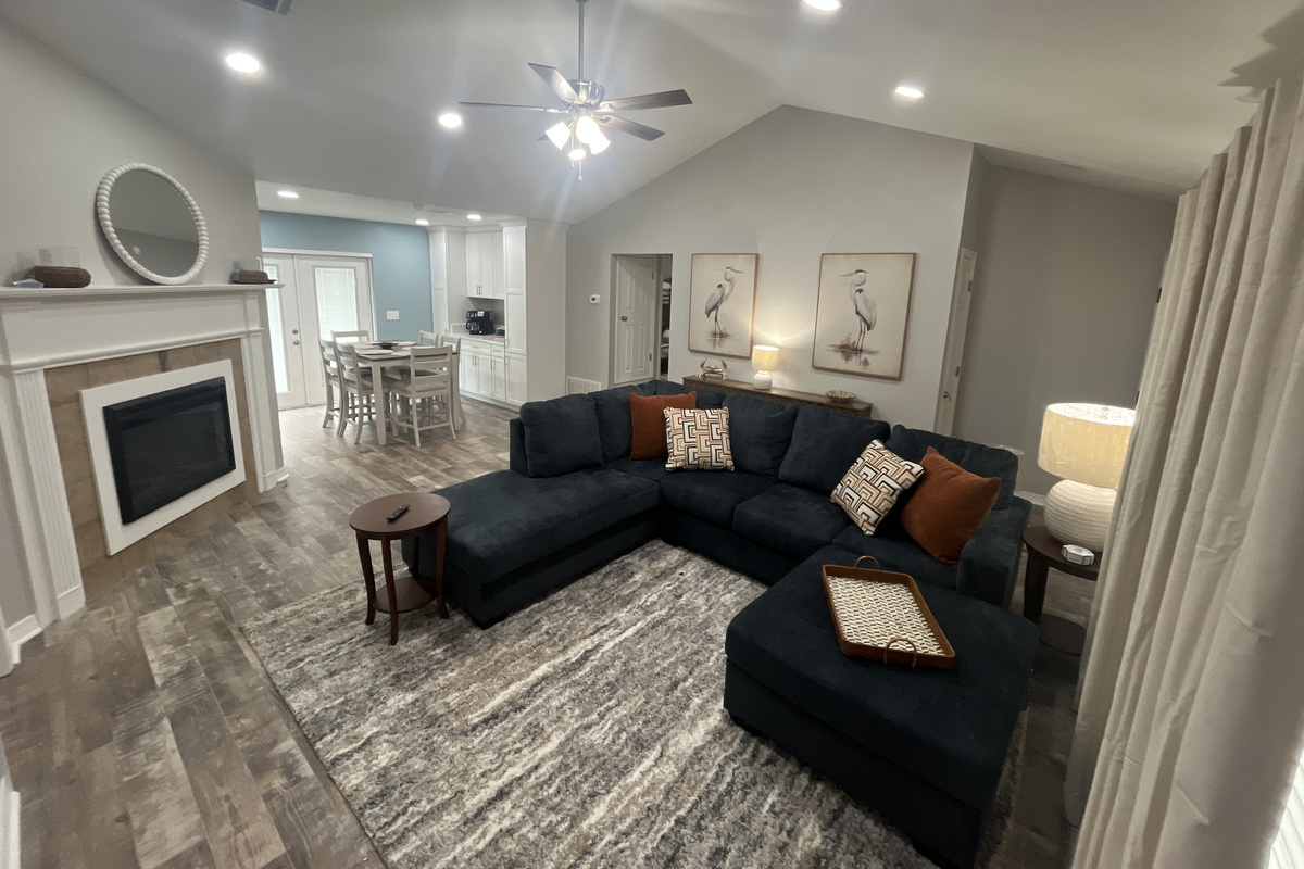 Spacious living room and dining area with access to the back deck area.