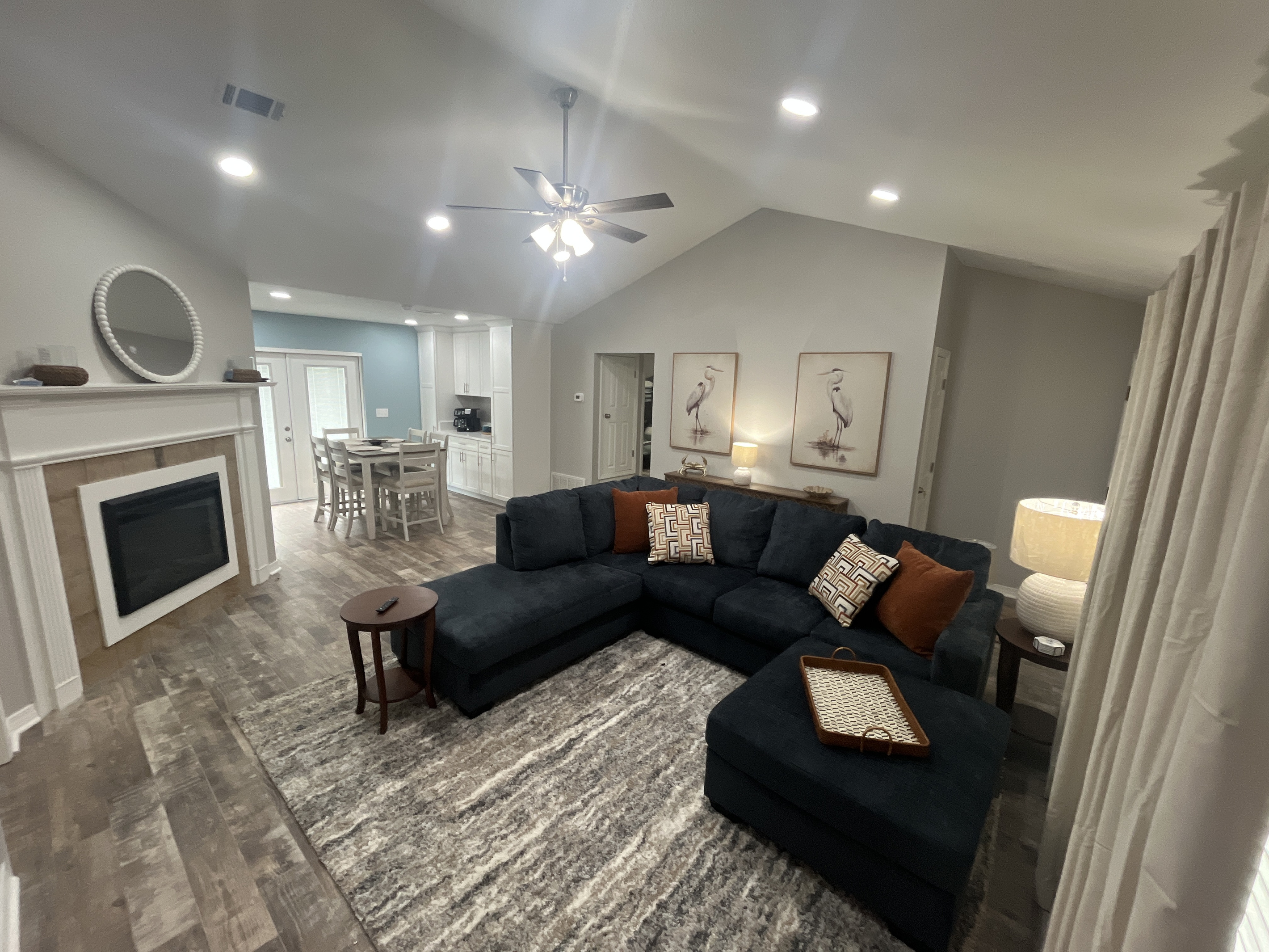 Spacious living room and dining area with access to the back deck area.