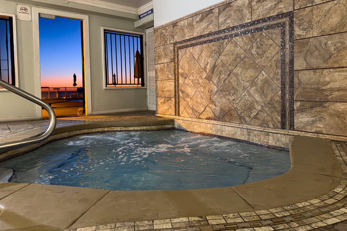This covered jacuzzi protects you from the wind while you soak. It is located right next to the main pool for easy access.