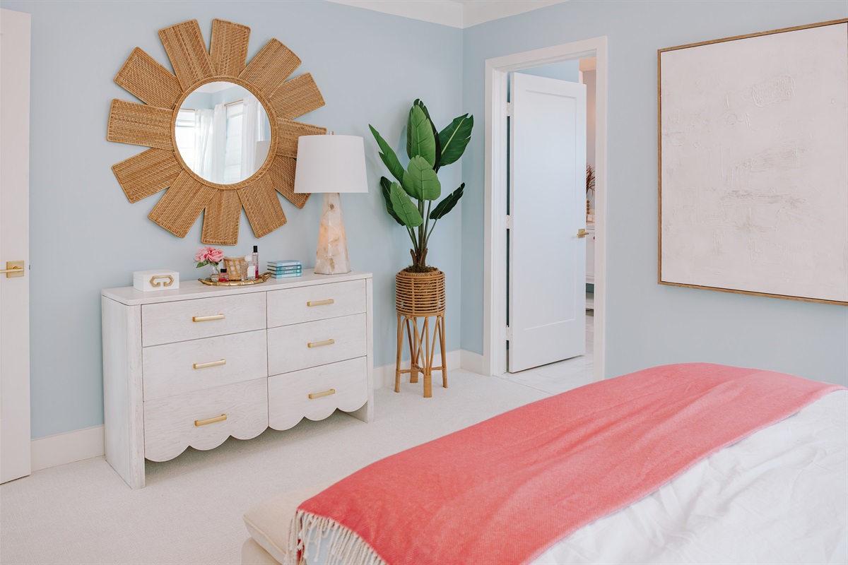 The main bedroom is carefully designed and decorated, containing an ensuite full bathroom and expansive walk-in closet.