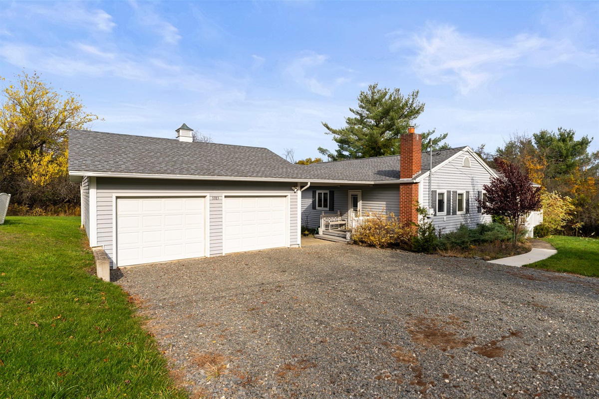 Charming home with parking for up to four cars.