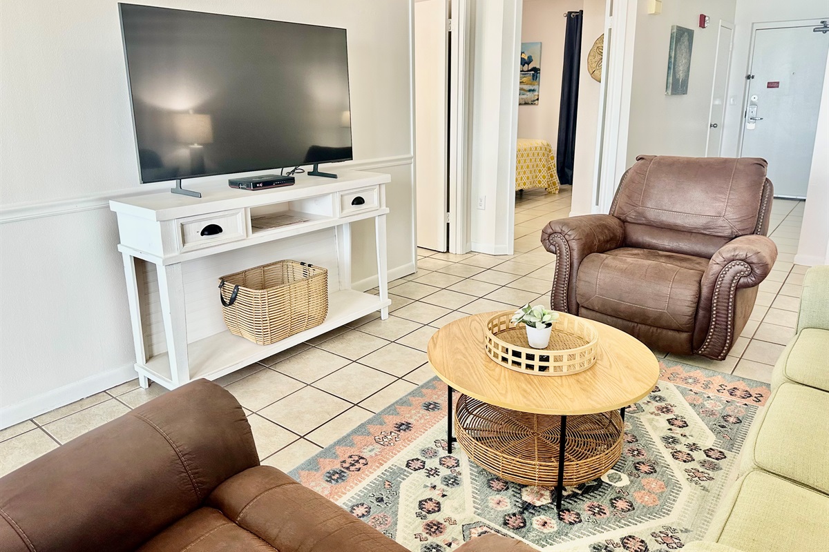 Smart tv in living room...first door is the bathroom, second door is the entrance to the Master