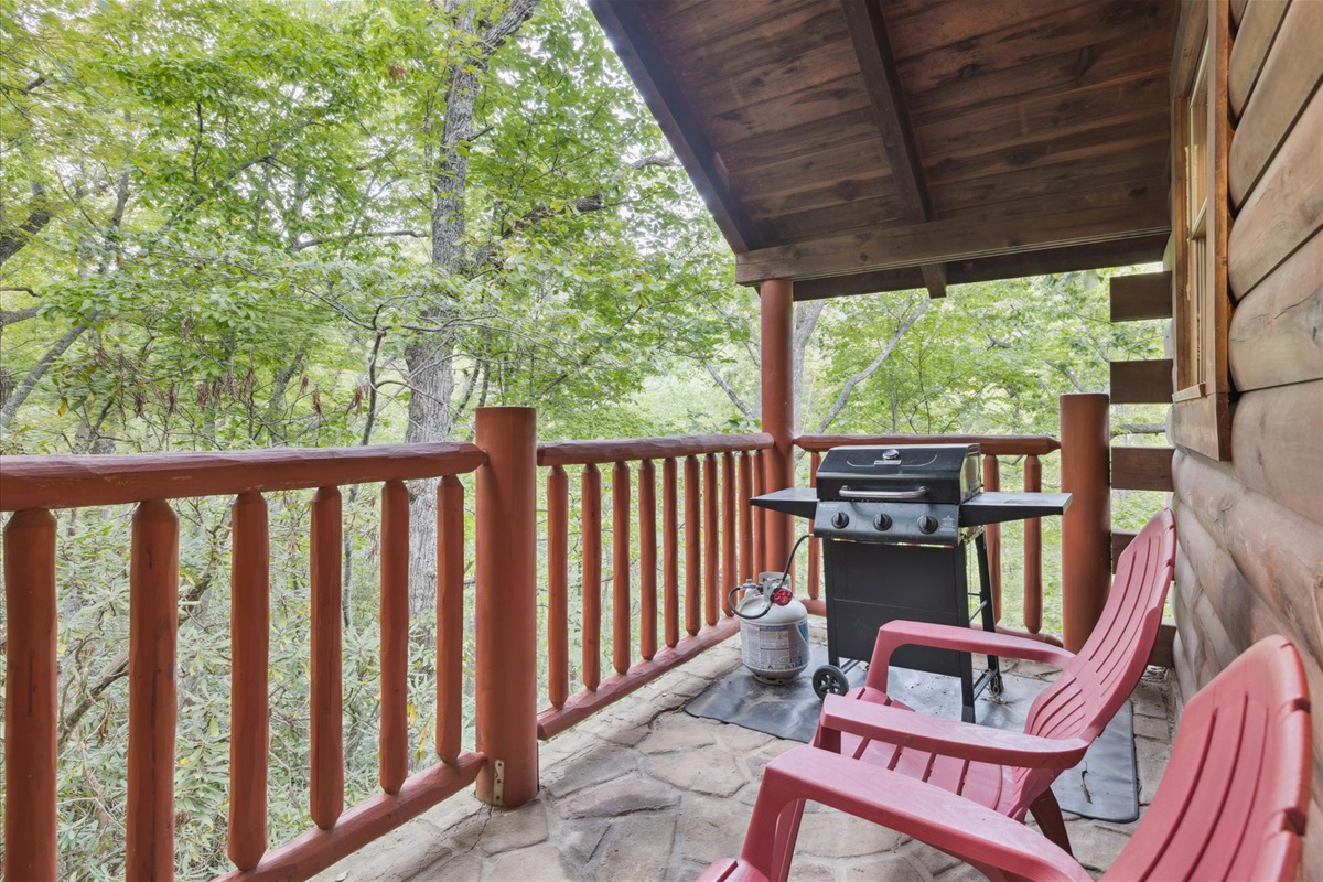 Gas grill with seating on deck