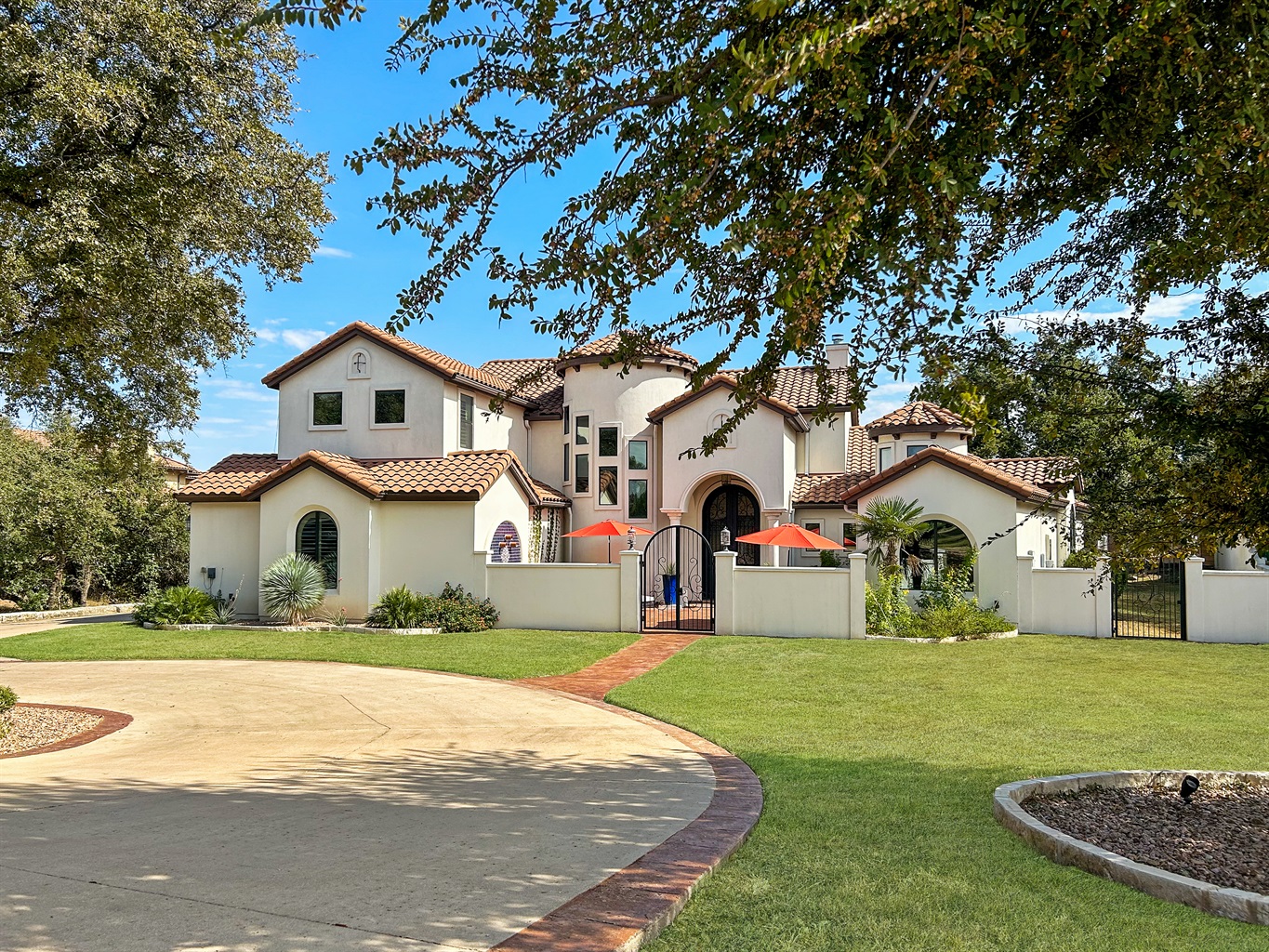 First impressions matter! Our front entrance showcases the timeless allure of Spanish-style design with a beautiful tile roof. Come explore!