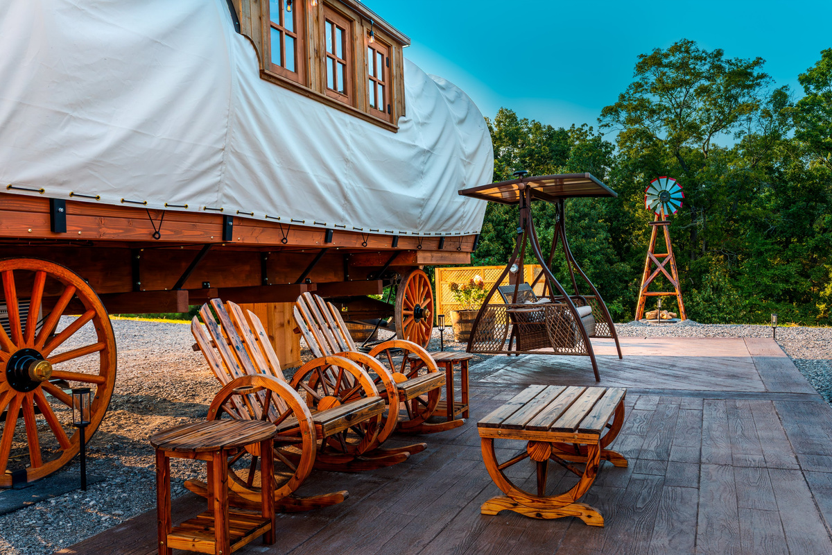 Wagon-wheel rocking chairs and patio seating create the perfect spot to unwind outside.