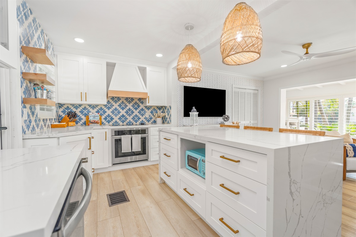 Clear shot of the microwave and island storage for modern convenience.