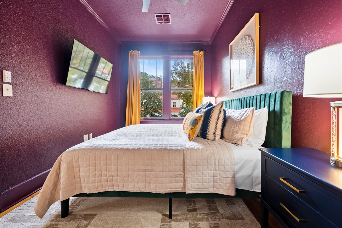 Another view of the king bedroom reveals its warm tones and elegant touches, perfect for unwinding.