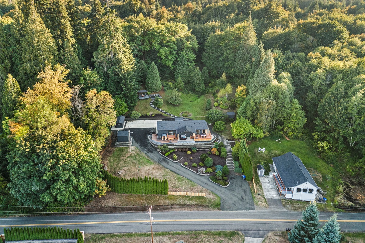 Bird’s-eye perspective of the peaceful setting, surrounded by lush meadow-like grounds