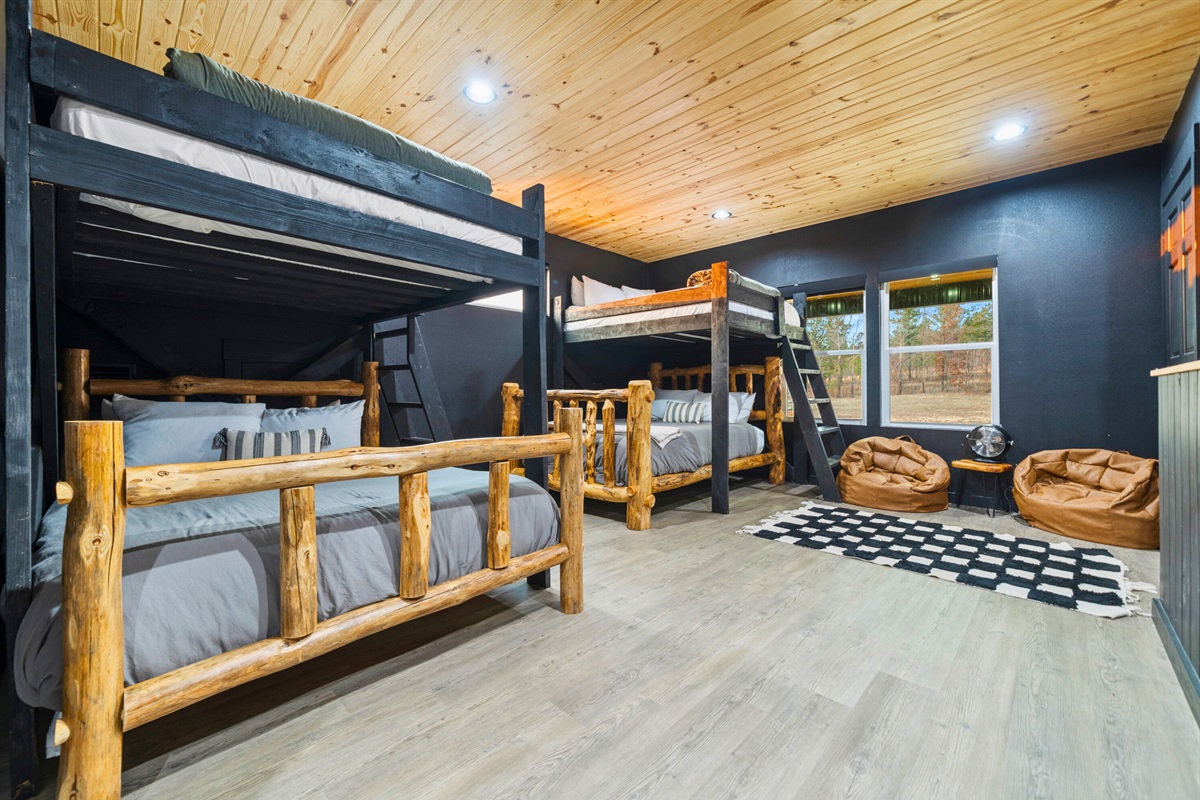 With multiple bunks and an open layout, this room is designed for fun, sleepovers, and shared memories.