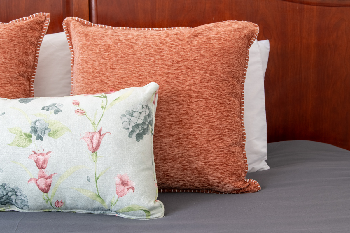 Cozy bedding and thoughtful touches help make this bedroom feel like home. It's the perfect place to recharge before tomorrow's Birmingham adventures.